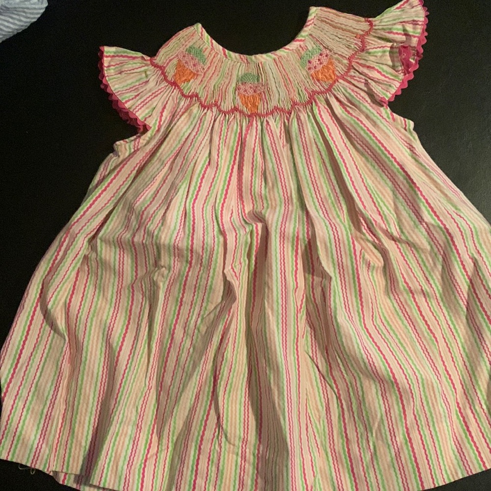 12 month smock dress.  Rainbow stripped color.